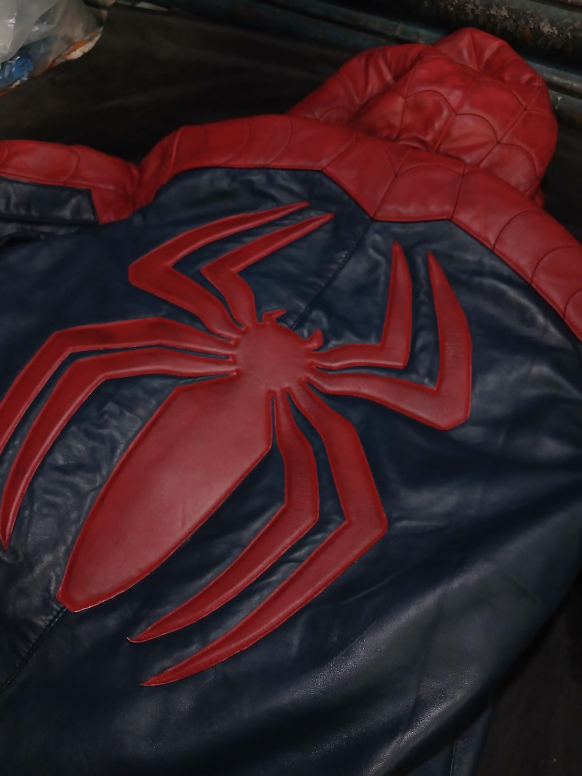 Red and blue hooded cosplay jacket back view